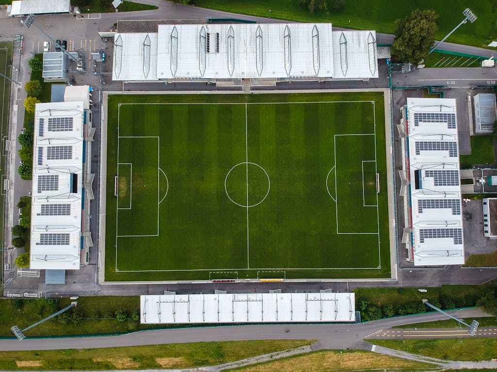 Explore a top-down view of a contemporary soccer stadium in Liechtenstein, showcasing architectural and sports elements.